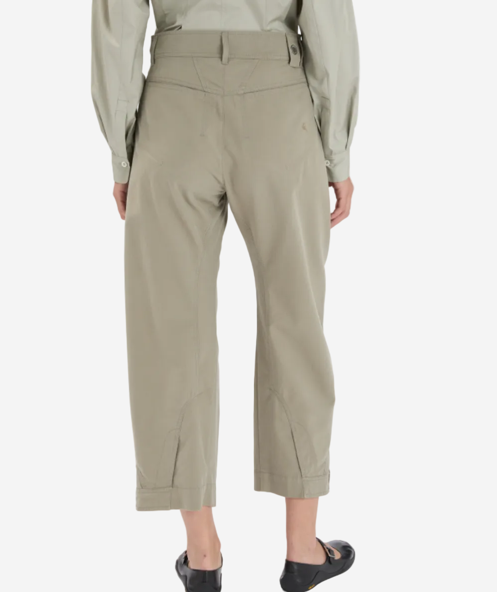 Person wearing beige pants on a white background