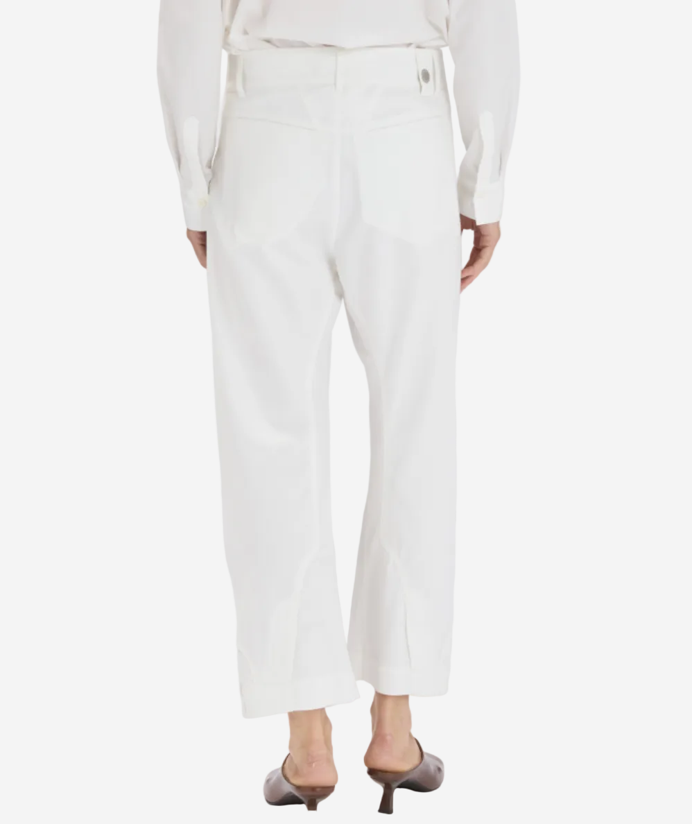 White pants worn by a person on a white background