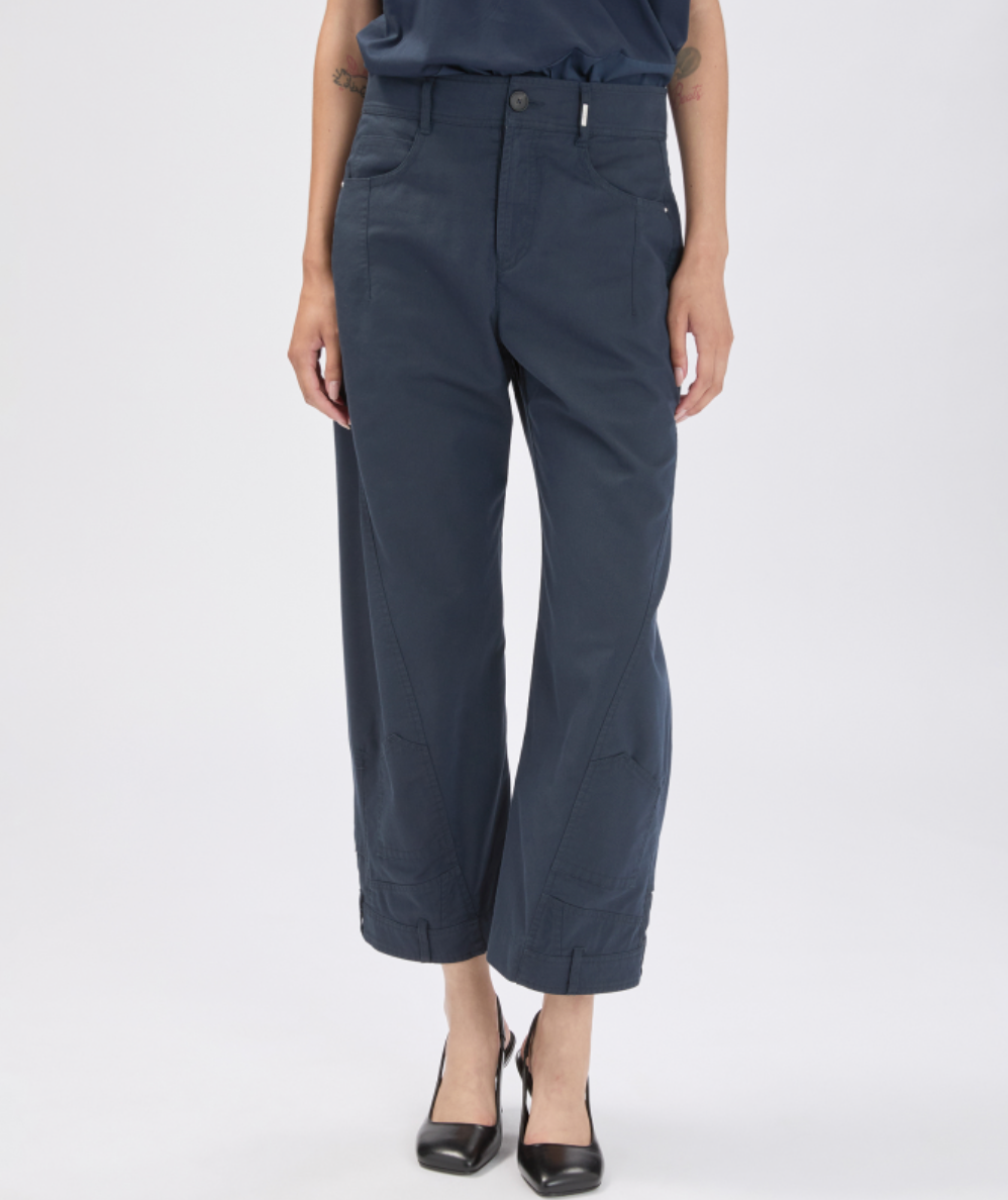 Person wearing navy blue pants on a white background