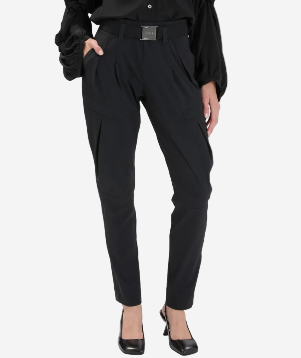 Black pants worn by a person on a white background