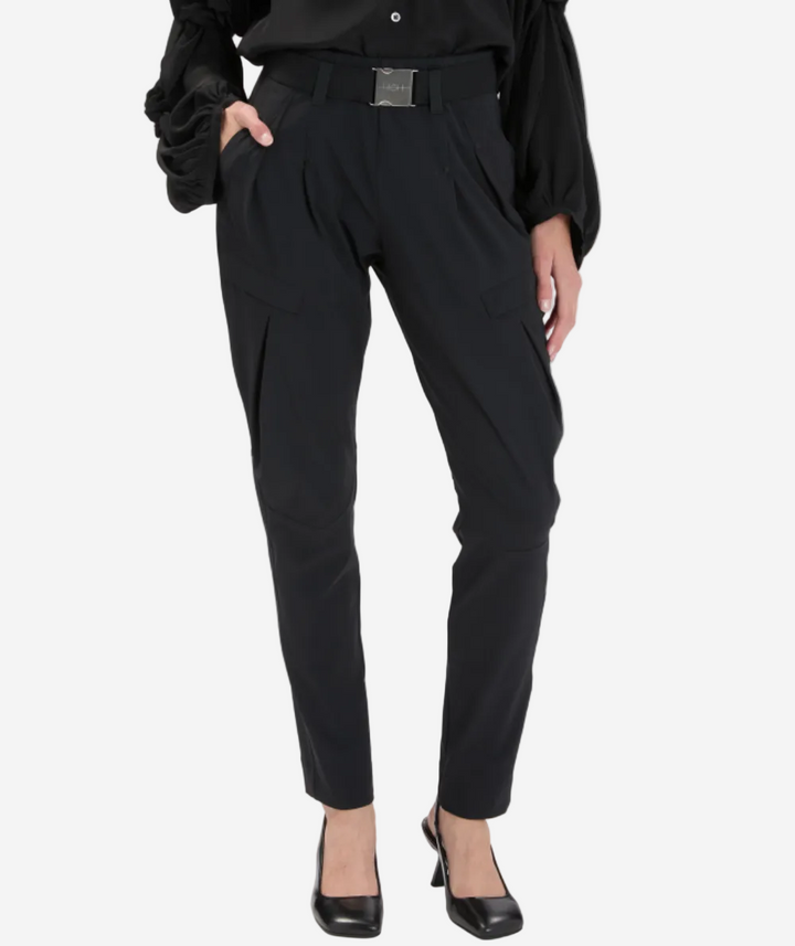 Black pants worn by a person on a white background