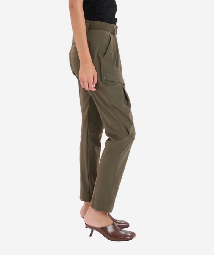 Olive green cargo pants worn by a person on a white background