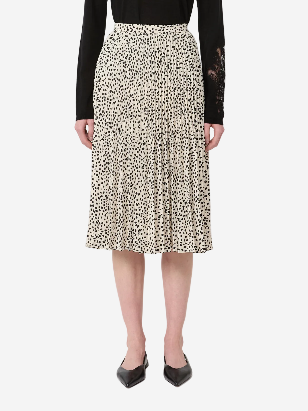 Person wearing a leopard print skirt on a white background