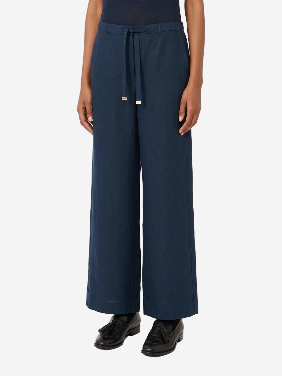 Navy wide-leg pants worn by a person on a white background