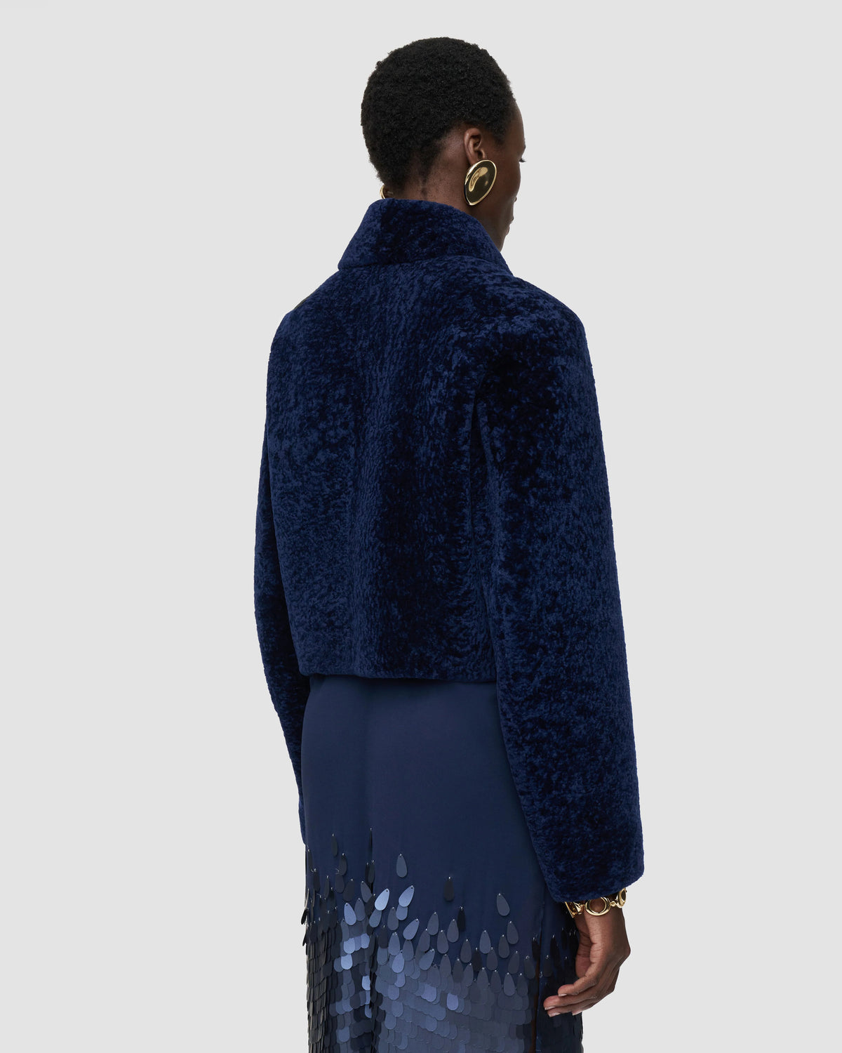 Back view of the JOSEPH Liris cropped shearling jacket showing the raglan sleeves and boxy shape