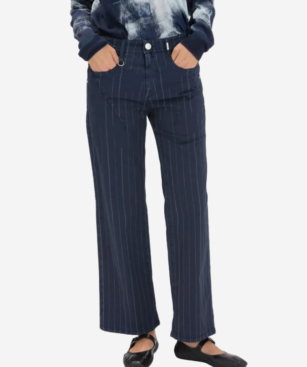 Navy pinstripe pants worn by a person on a white background