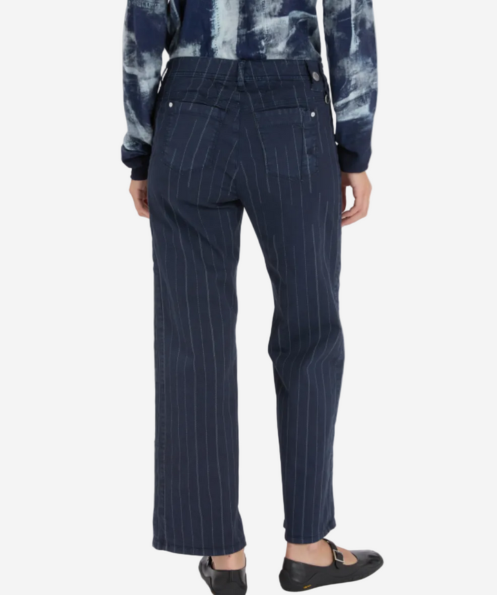 Navy pinstripe pants worn by a person on a white background