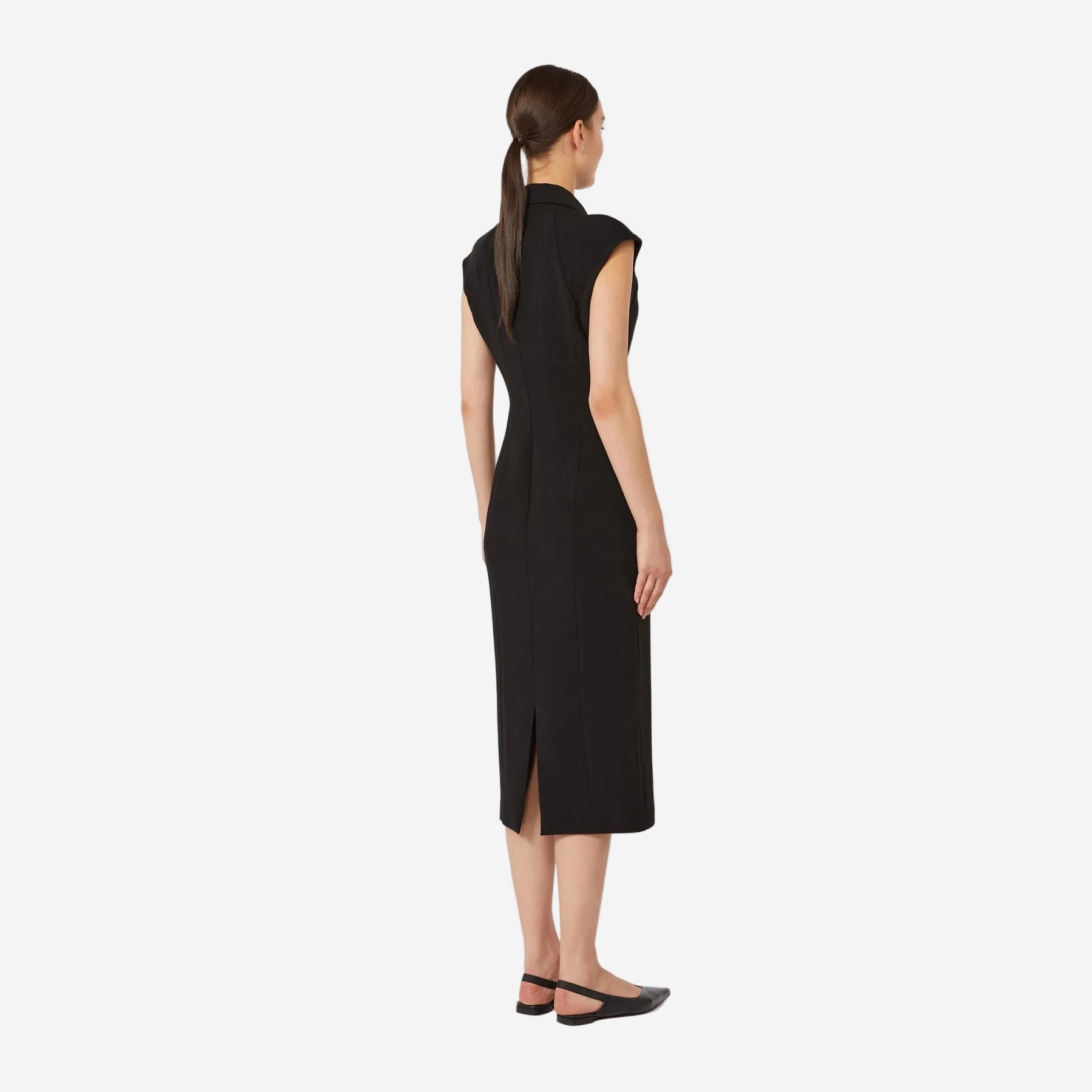 Woman wearing a black sleeveless dress on a white background