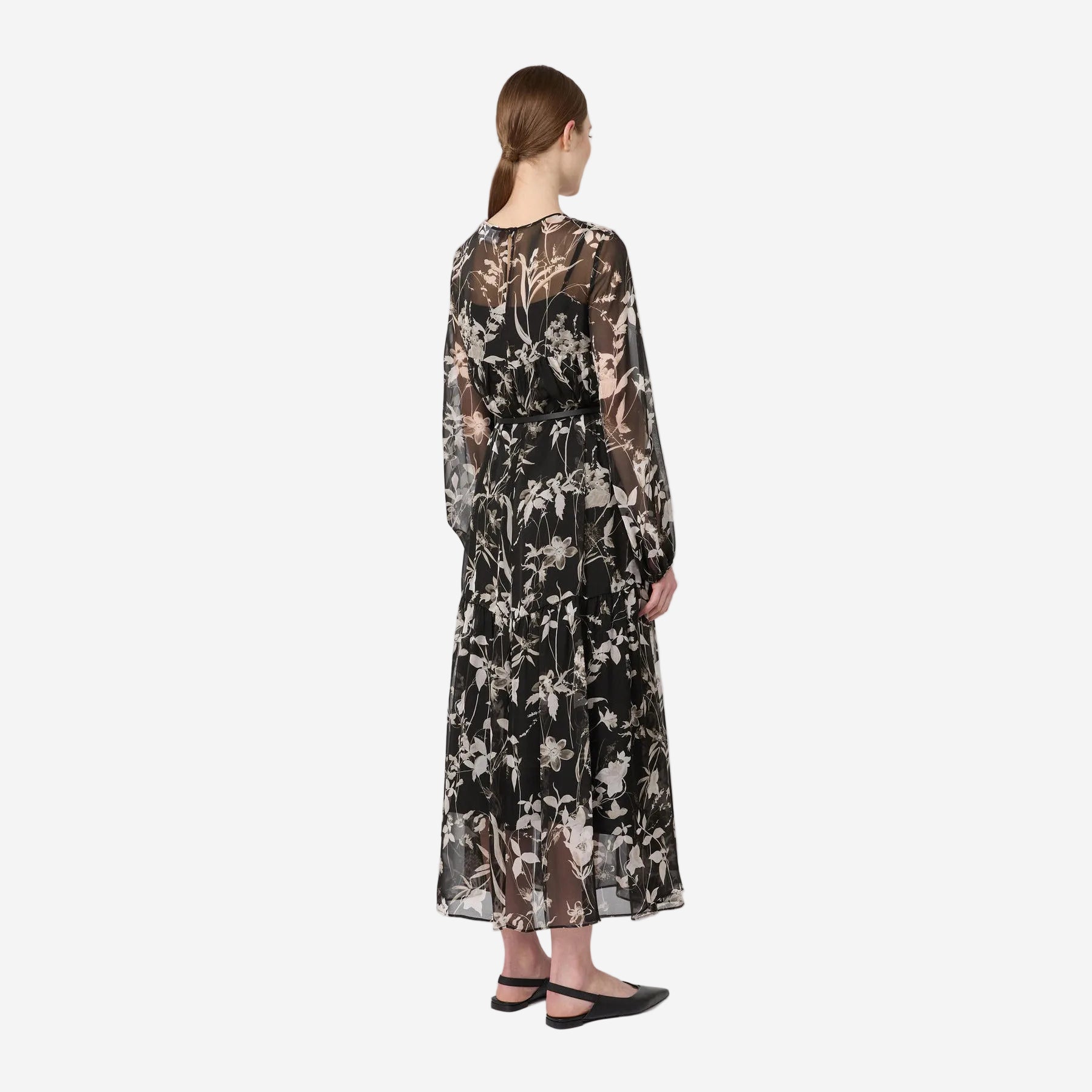 Woman wearing a floral dress on a white background