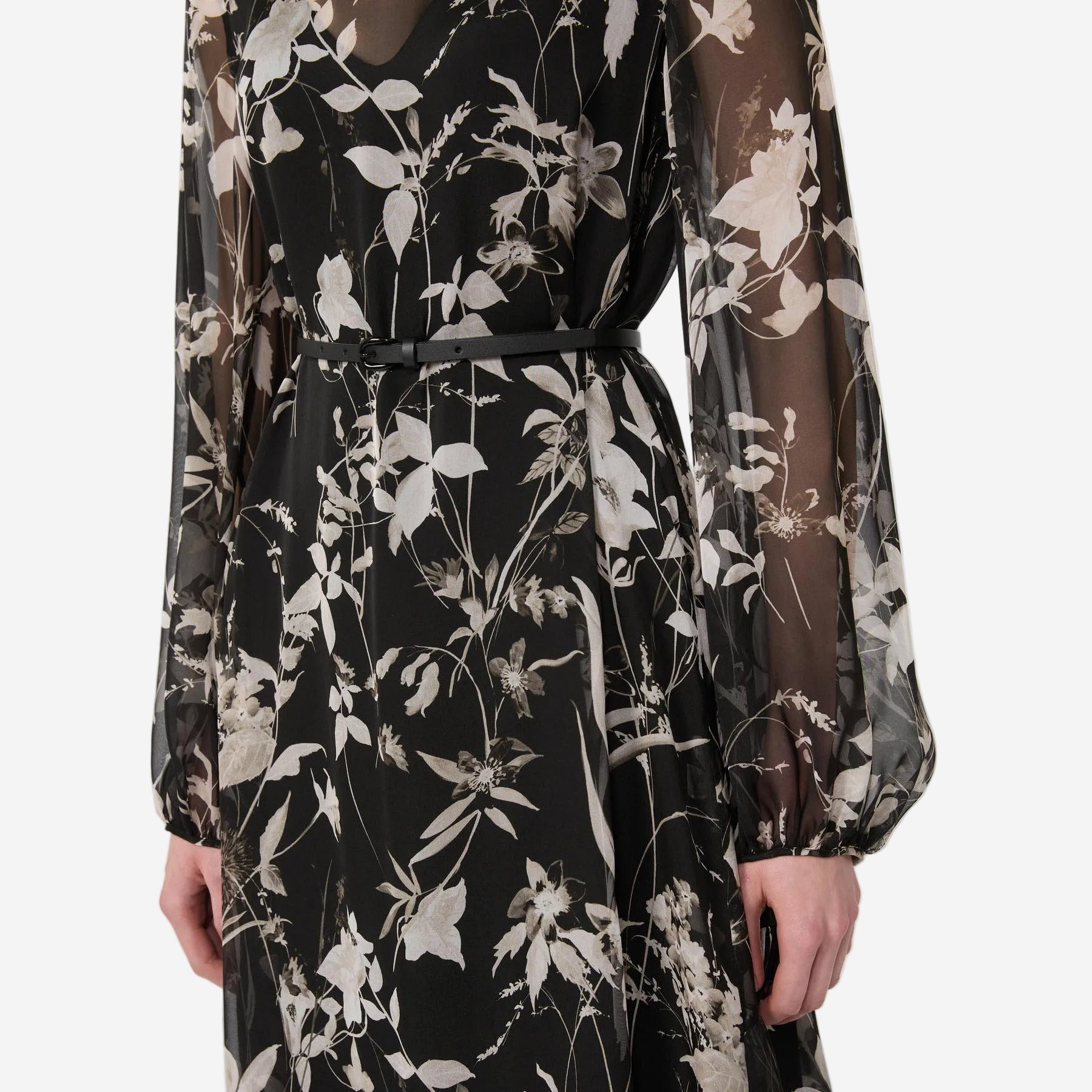 Black floral dress with sheer sleeves on a white background