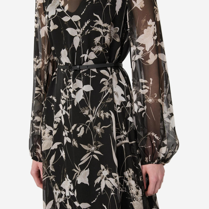 Black floral dress with sheer sleeves on a white background