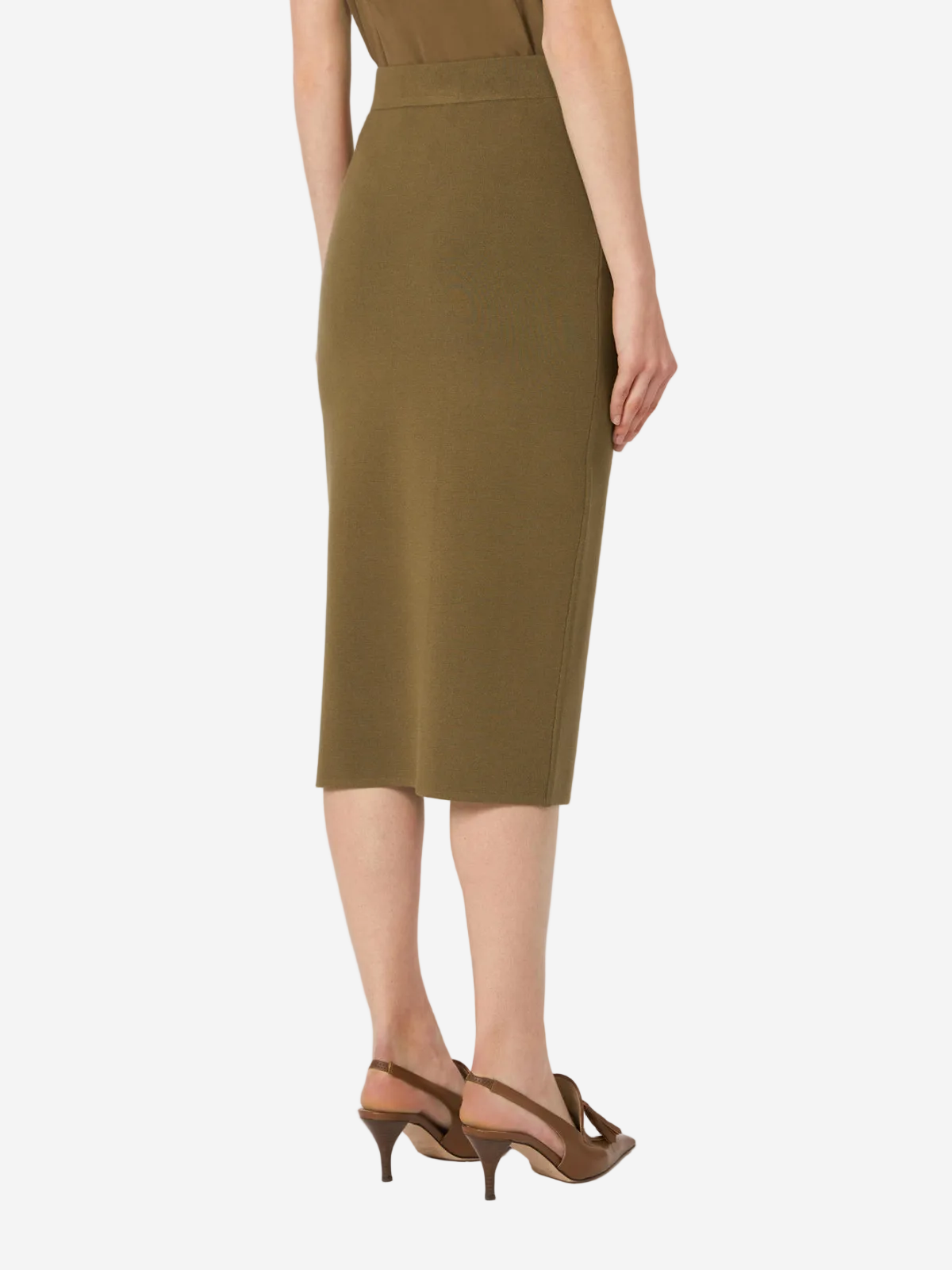 Person wearing a green dress on a white background