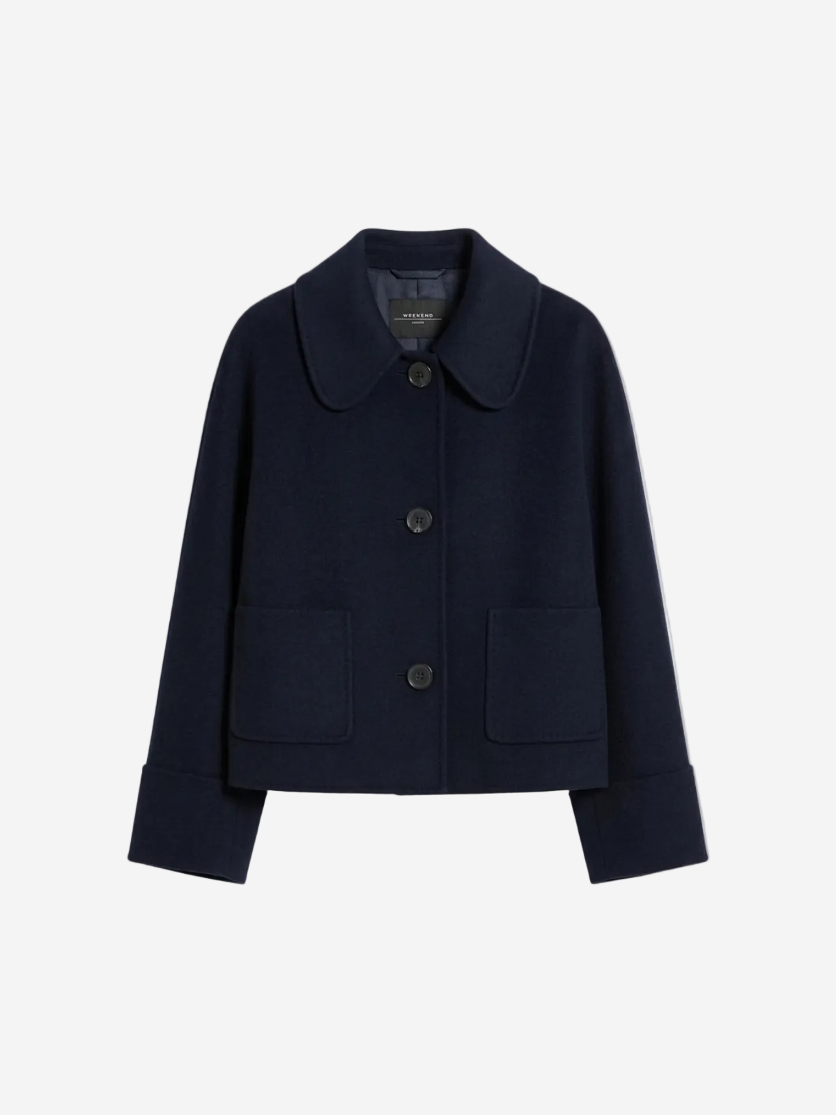 Navy blue coat with button details on a light gray background at Christensen Copenhagen