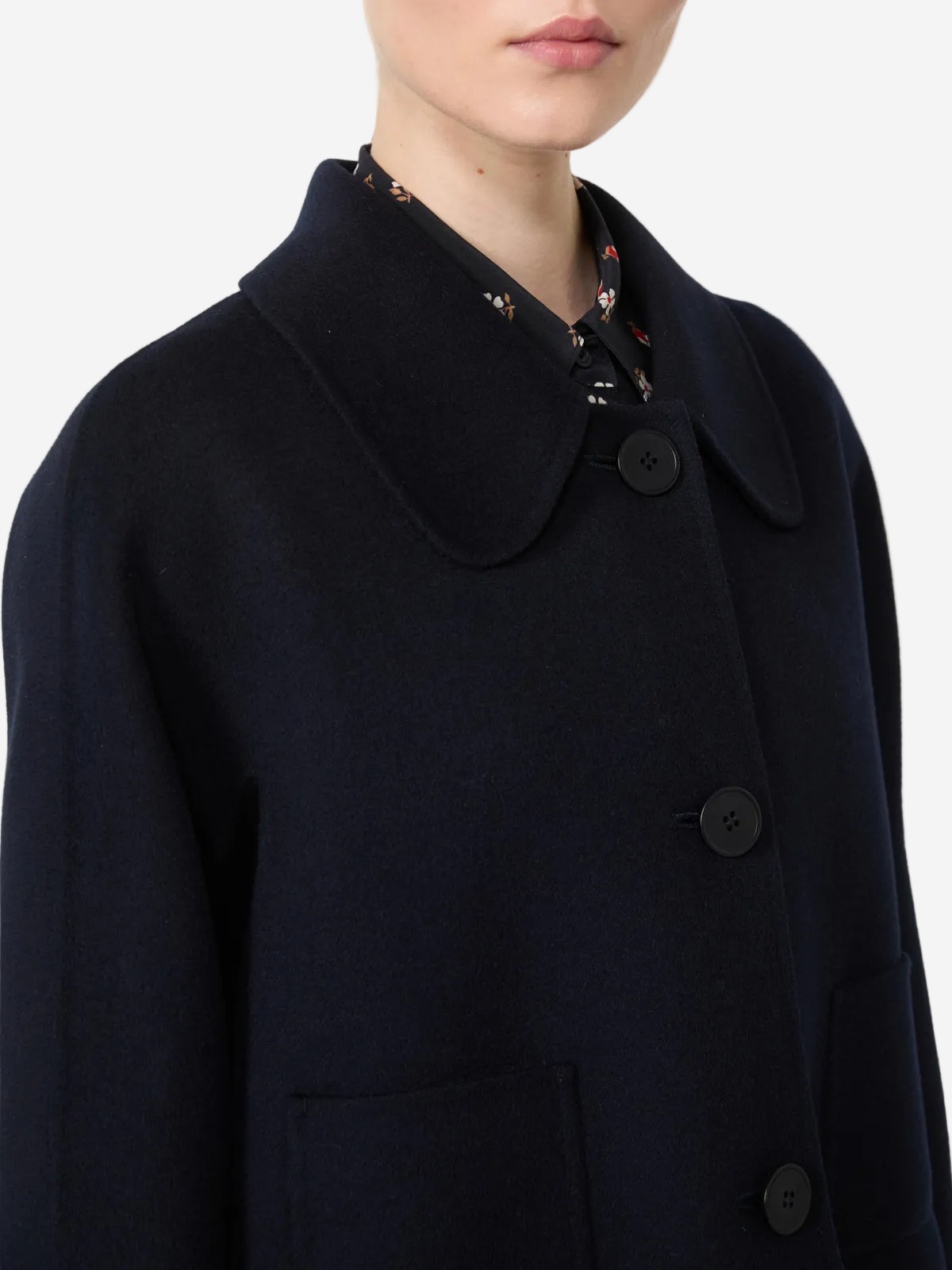 Navy blue coat with a collar on a white background