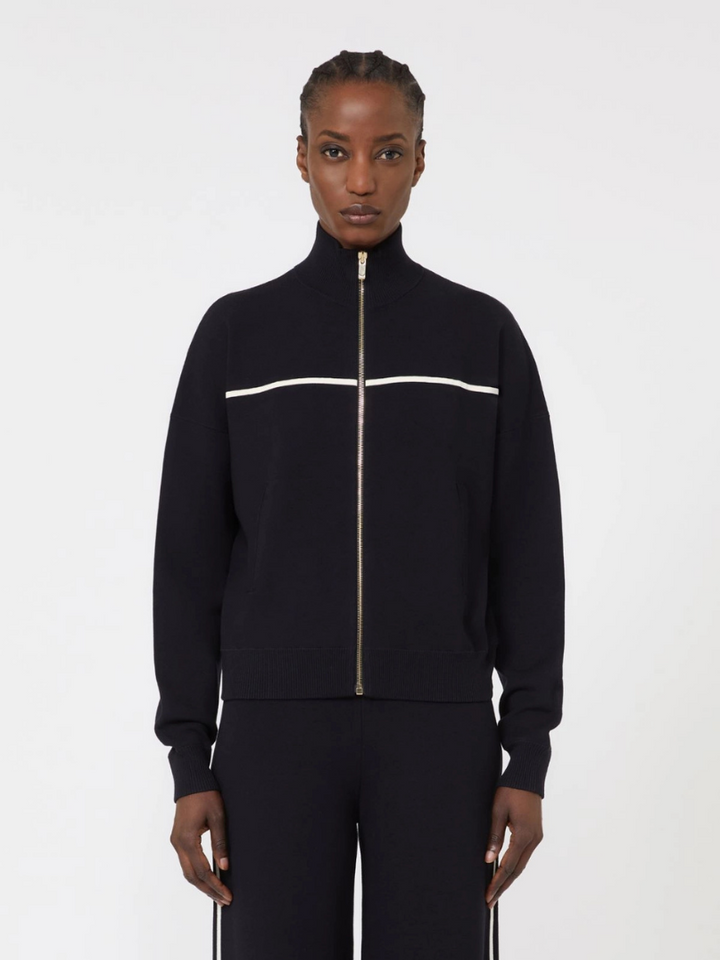 Person wearing a black tracksuit with a white stripe on a white background