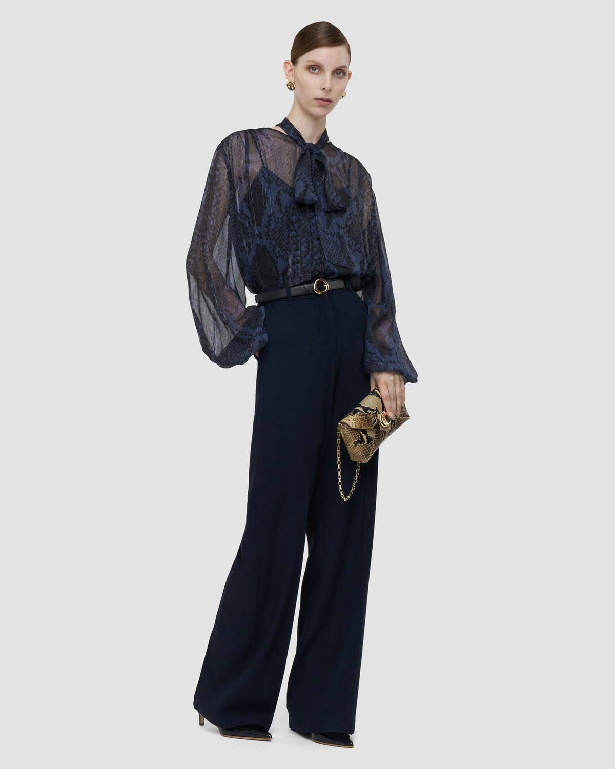 JOSEPH Mitae wide-leg trousers in Prussian blue, styled with a sheer tie-neck blouse at Christensen Copenhagen Sydney