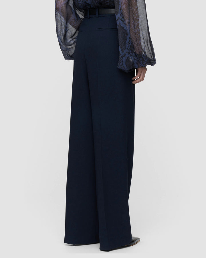 Back view of the JOSEPH Mitae trousers showing the full-length wide leg
