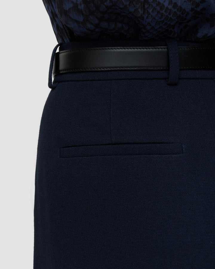 Close-up of the welt back pocket and textured fabric on the JOSEPH Mitae trousers