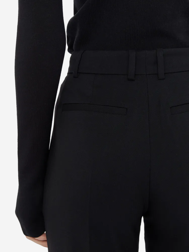 Black suit jacket and pants on a white background