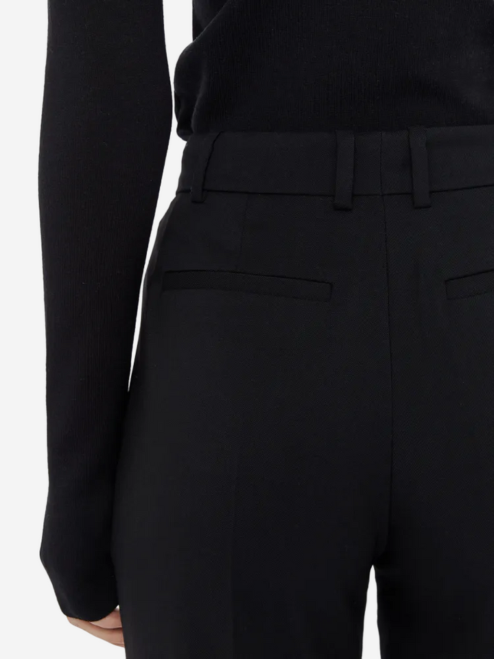 Black suit jacket and pants on a white background