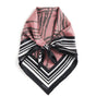 Pink scarf with black and white pattern on a white background