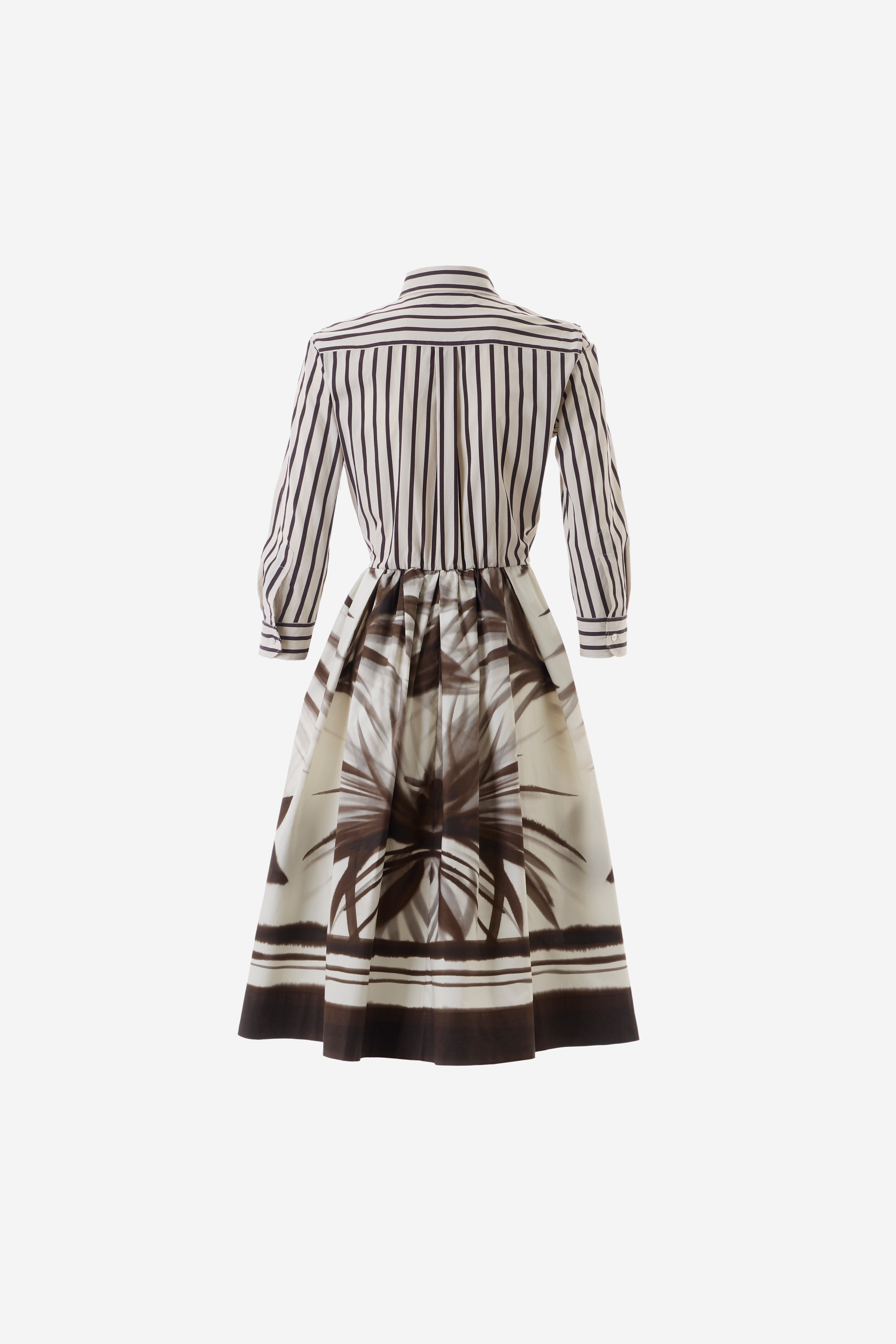 Black and white striped dress with a floral pattern on a white background