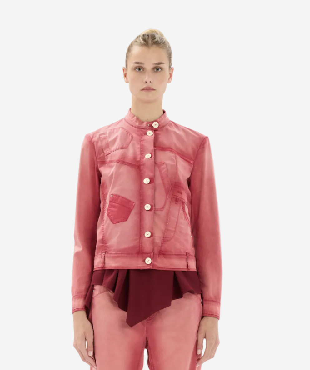 Person wearing a pink jacket and pants on a white background