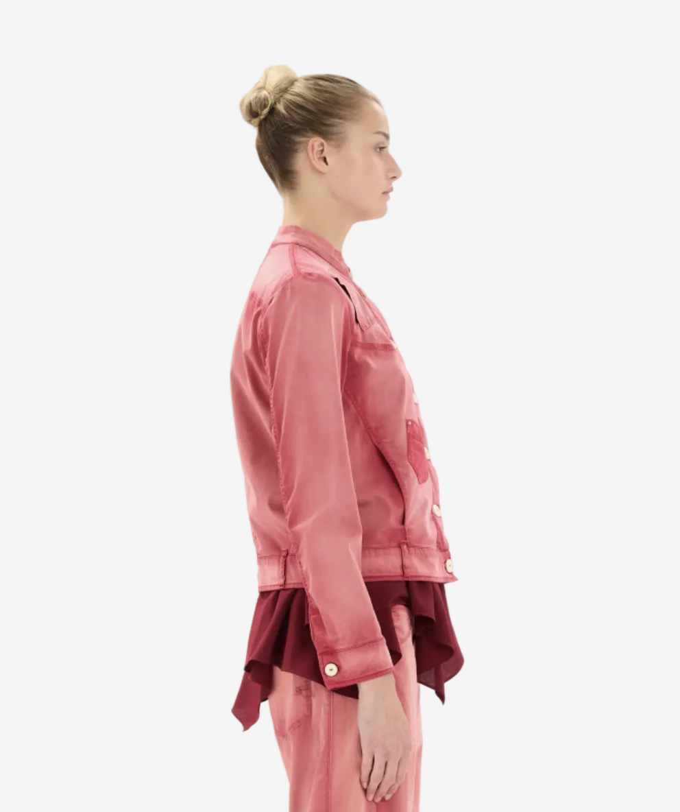 Person wearing a pink outfit on a white background
