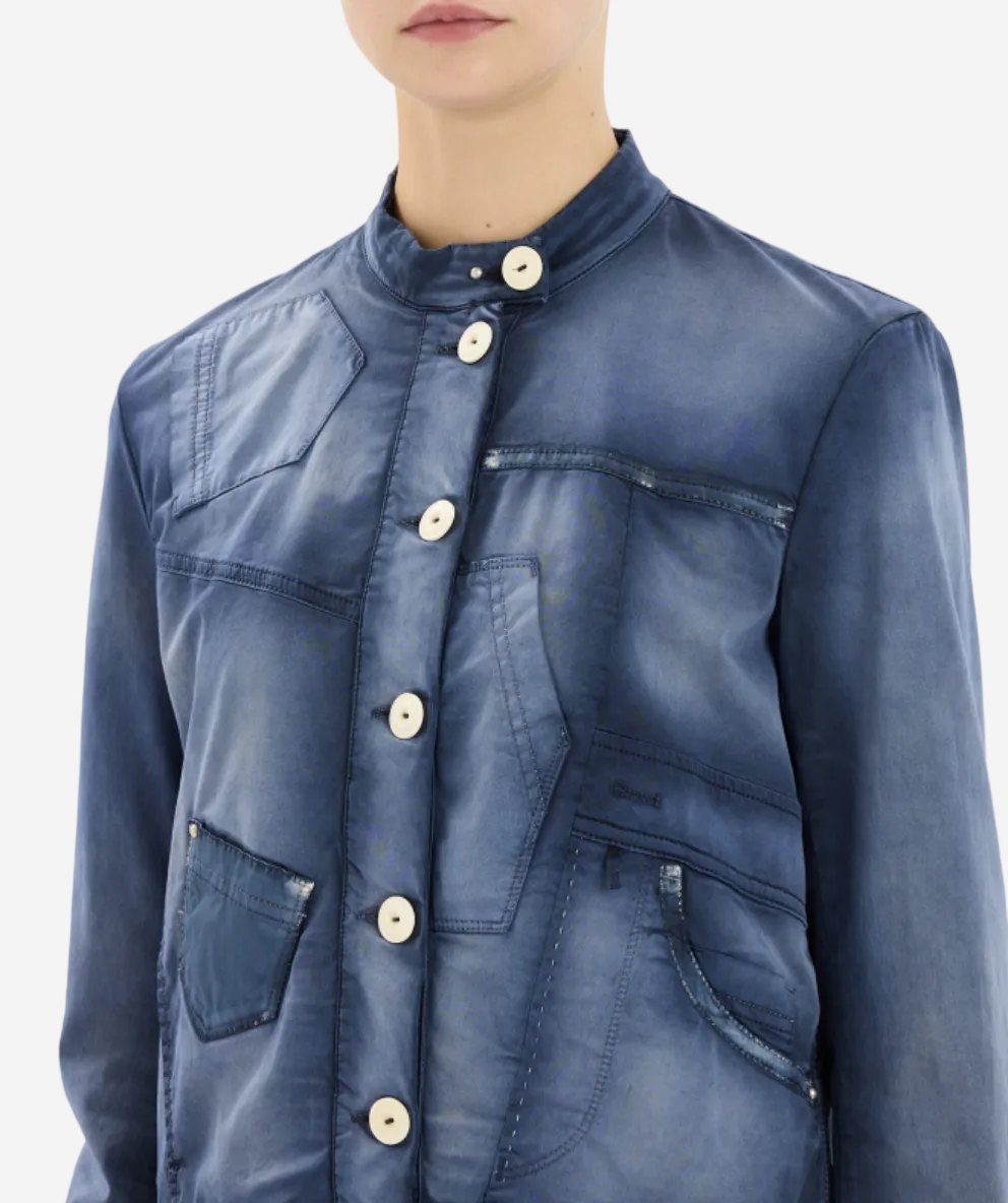Blue denim jacket with button details on a white background