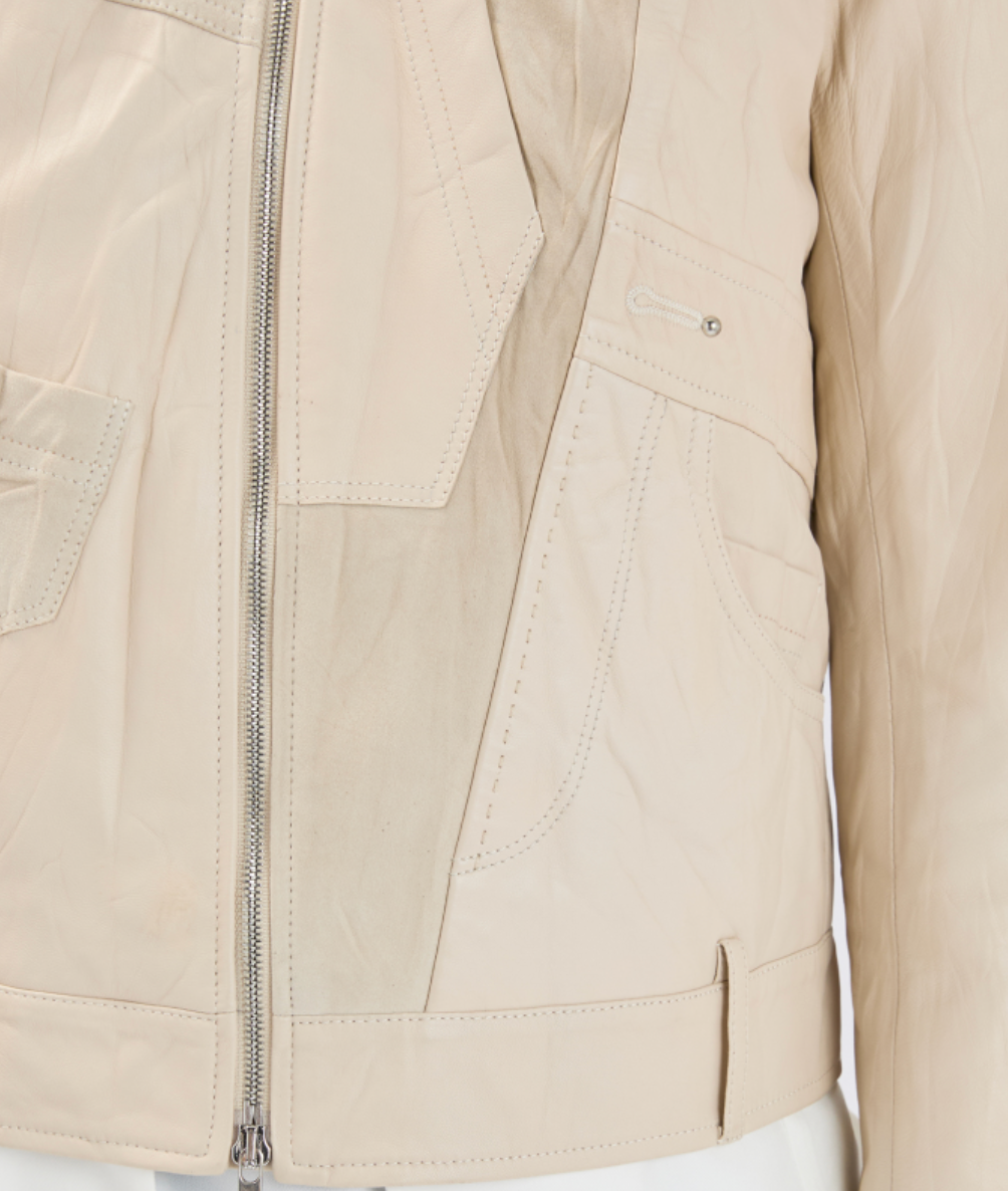 Close-up of a beige jacket with a zipper and pockets on a white background