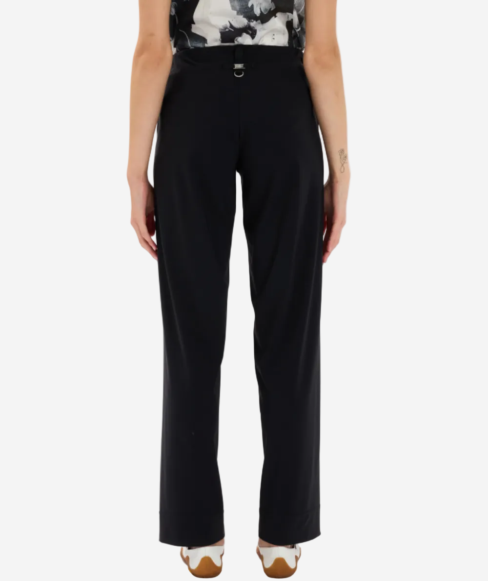 Person wearing black pants on a white background