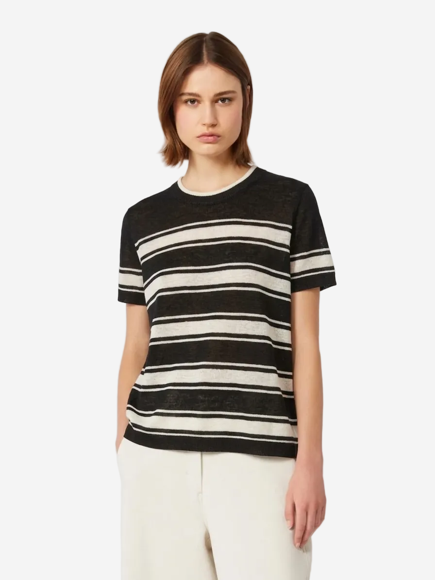 Woman wearing a black and white striped shirt on a white background