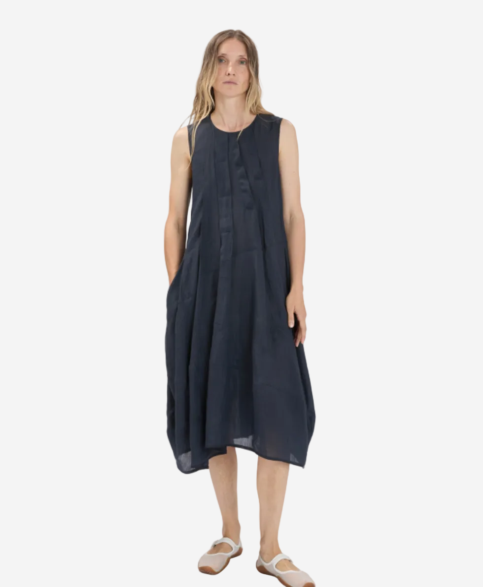 Woman wearing a black sleeveless dress on a white background