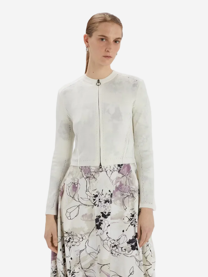 women in a white cardigan from Christensen Copenhagen
