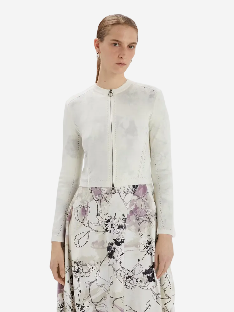 women in a white cardigan from Christensen Copenhagen