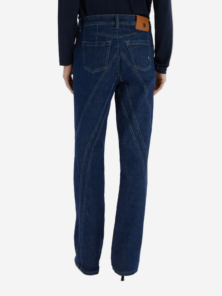 Blue jeans worn by a person on a white background