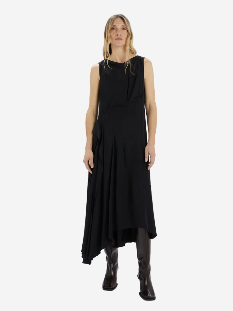 Woman wearing a black sleeveless dress on a white background