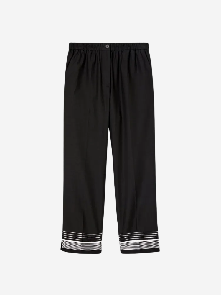 Black pants with striped cuffs on a white background
