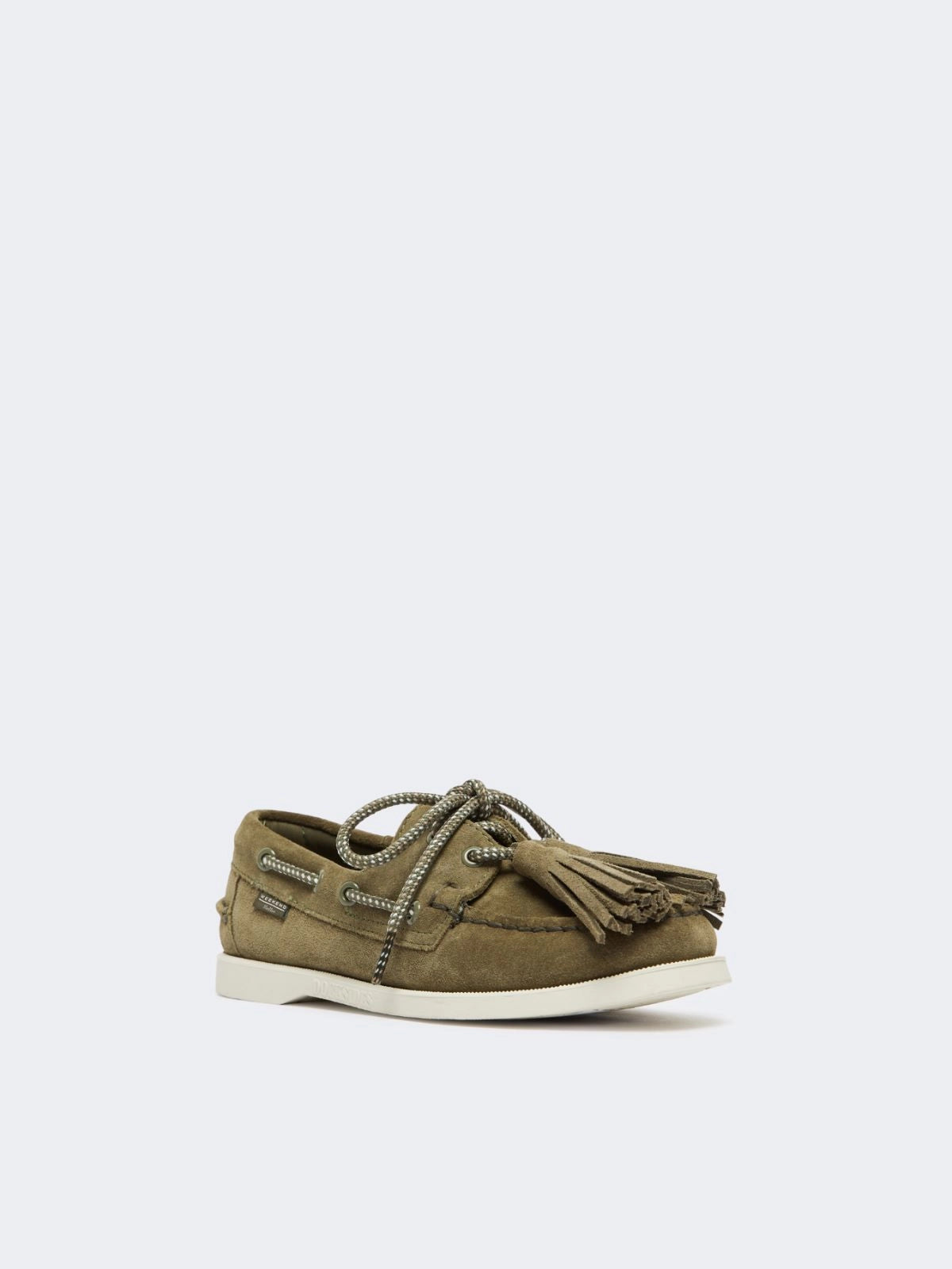 Green casual shoe with tassels on a white background