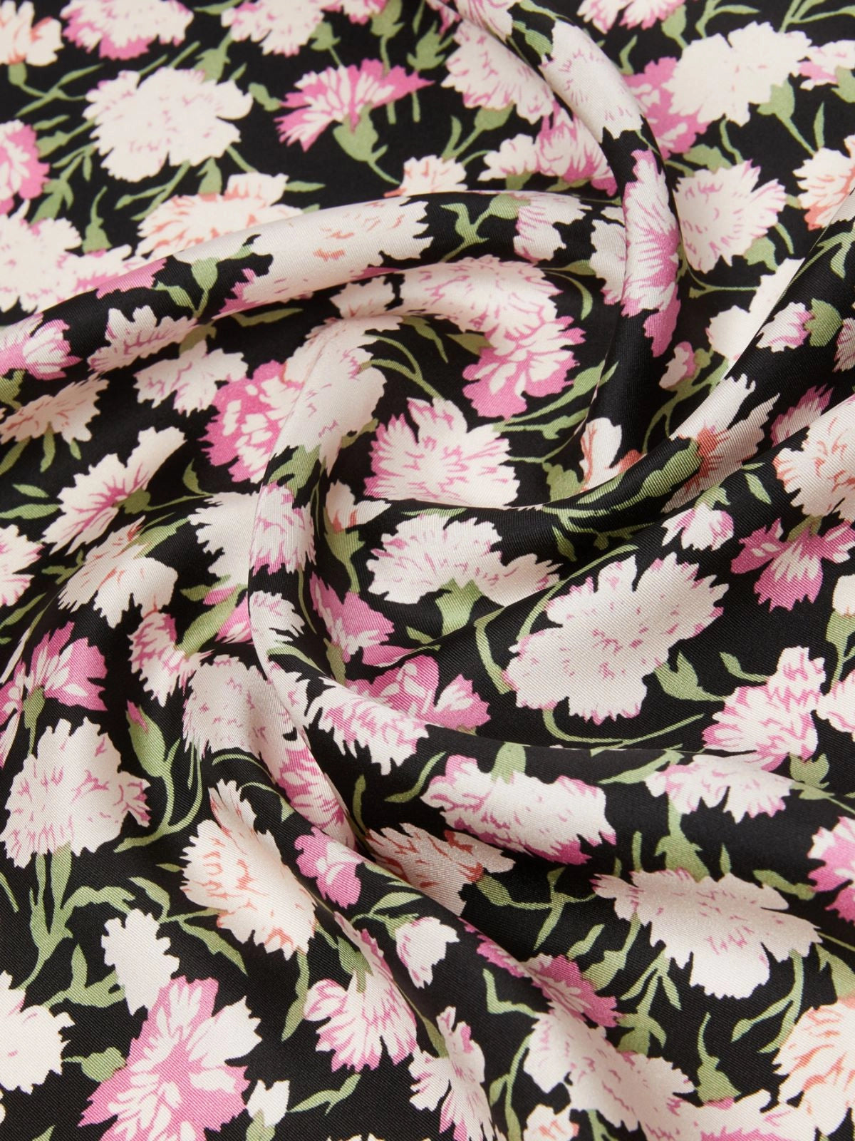 Floral fabric with pink and white flowers on a black background
