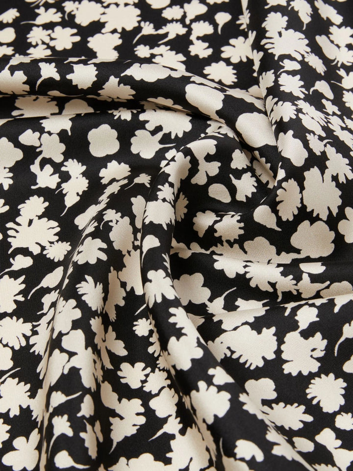 Black fabric with white floral pattern