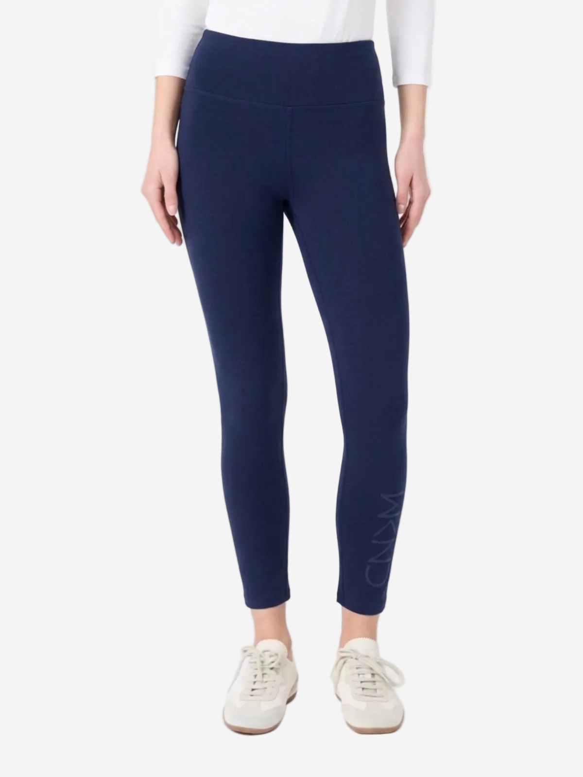 Navy leggings worn by a person on a white background