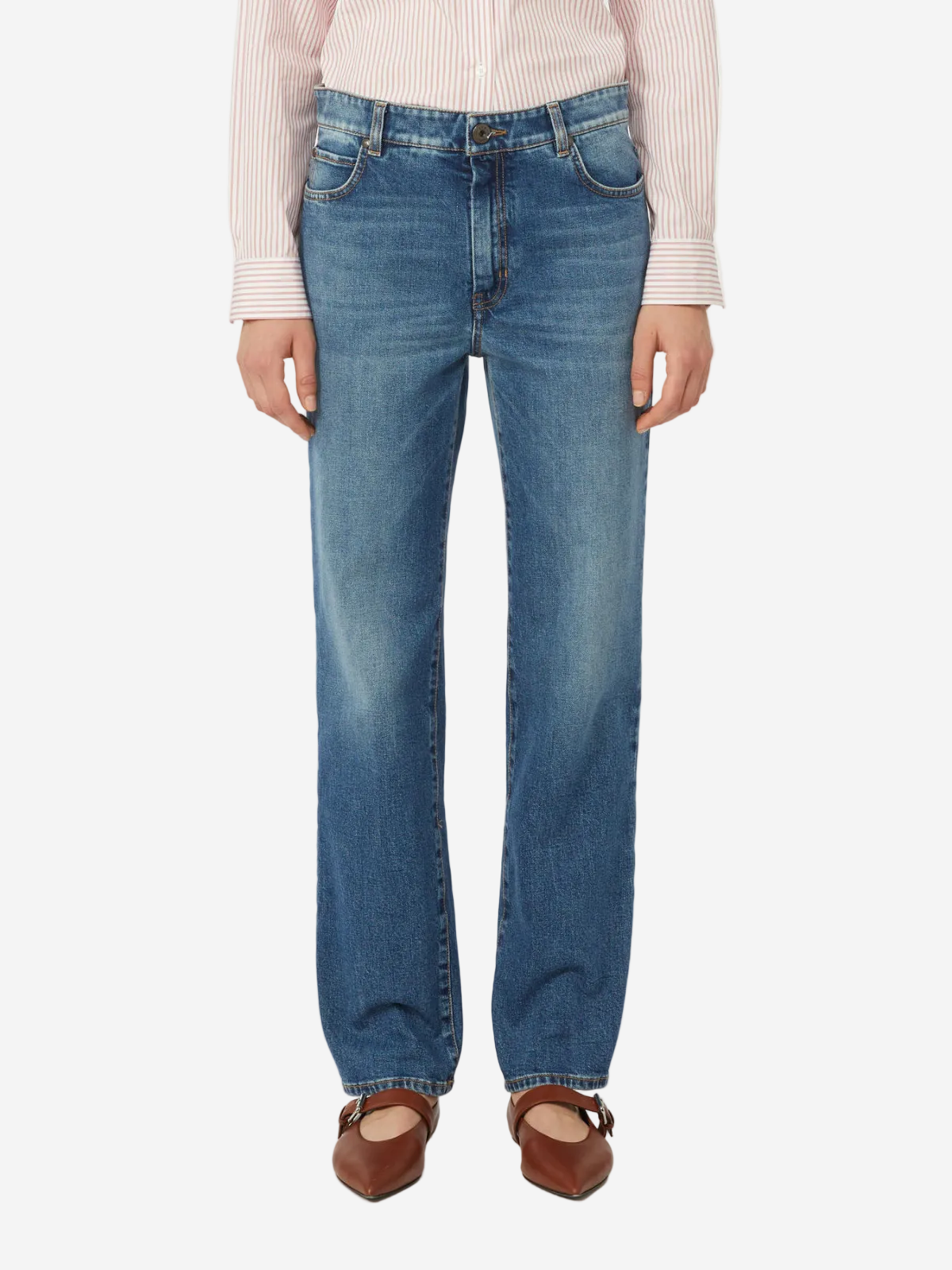 Person wearing blue jeans on a white background