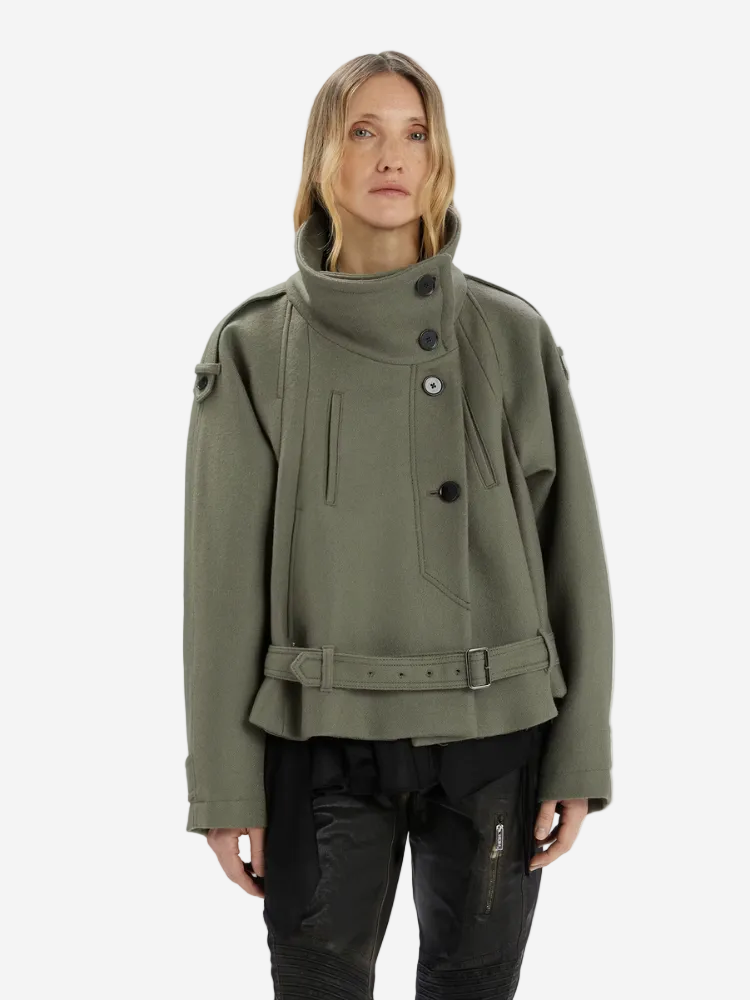 Person wearing a green jacket on a white background