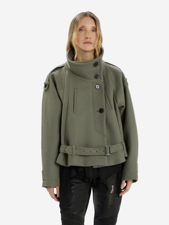 Person wearing a green jacket on a white background