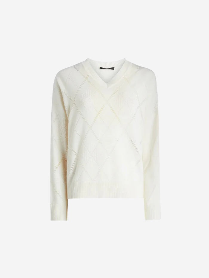 White sweater on a light beige background