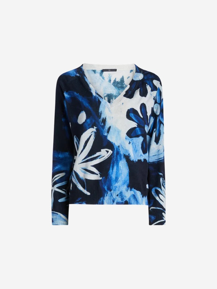 Blue and white floral patterned top on a white background
