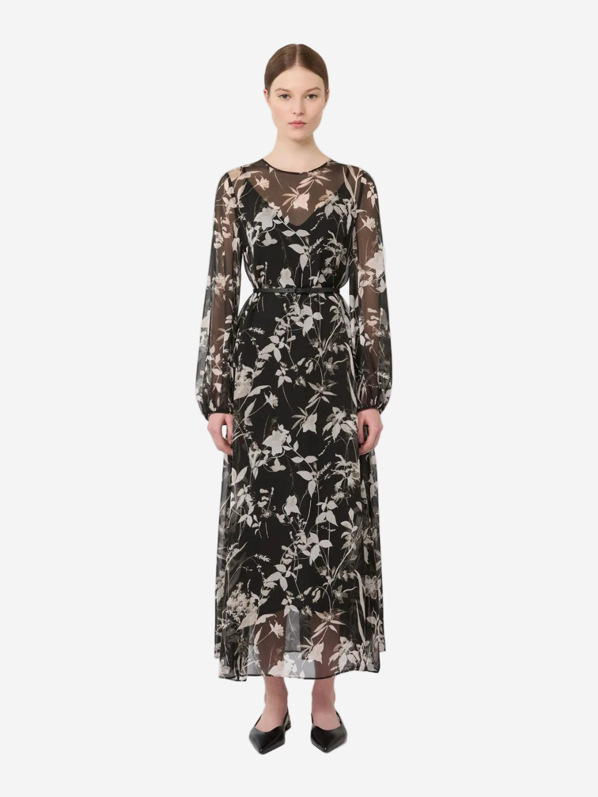 Woman wearing a floral dress on a white background