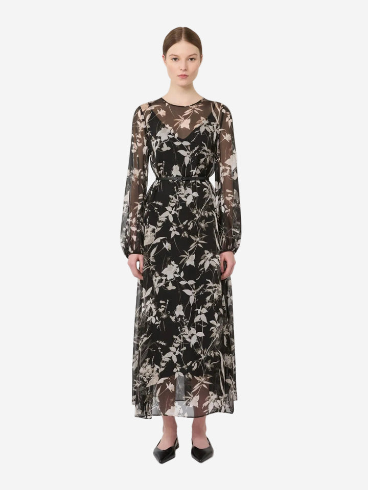 Woman wearing a floral dress on a white background