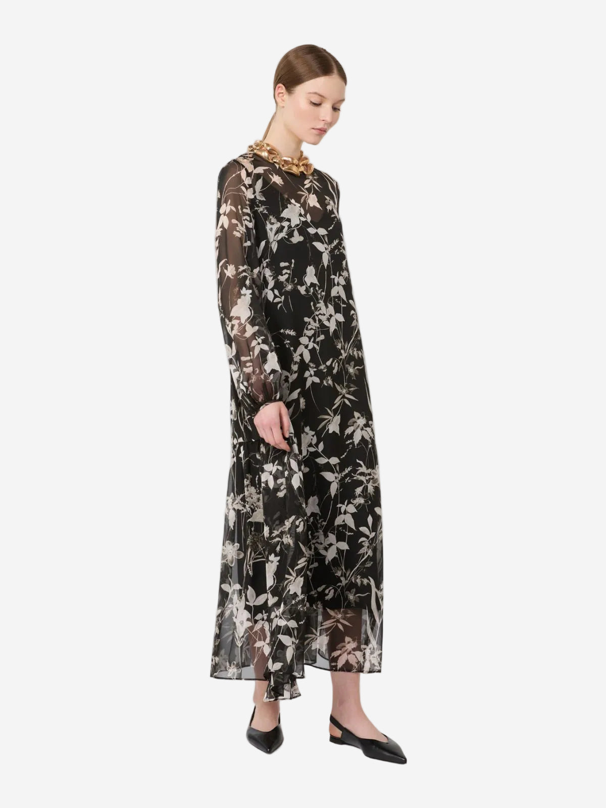 Woman wearing a floral dress on a white background